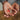 A hand holding brain supplement tablets